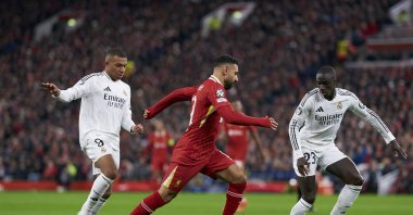 Liverpool&#039;s Mohamed Salah (C) dribbles the ball with Real Madrid&#039;s Ferland Mendy (R) and Kylian Mbappe challenging him during the UEFA Champions League 2024/25 league phase match at Anfield, Liverpool, U.K., Nov. 27, 2024. (Getty Images Photo)