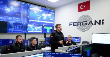 Fergani Space CEO Selçuk Bayraktar gestures alongside teammates amid the launch of the FGN-100-D2 satellite into space, Istanbul, Türkiye, Nov. 3, 2025. (DHA Photo)