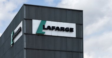 The logo of the French industrial company Lafarge displayed on a building of a cement plant, Paris, April 14, 2025. (AFP Photo)