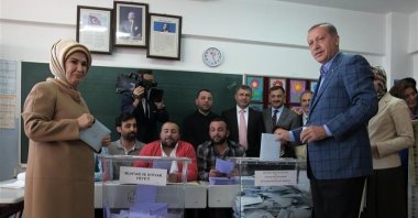 Then-Prime Minister Recep Tayyip Erdoğan and first lady Emine Erdoğan cast their ballots at a polling station, Istanbul, Türkiye, March 30, 2014. (AP Photo)