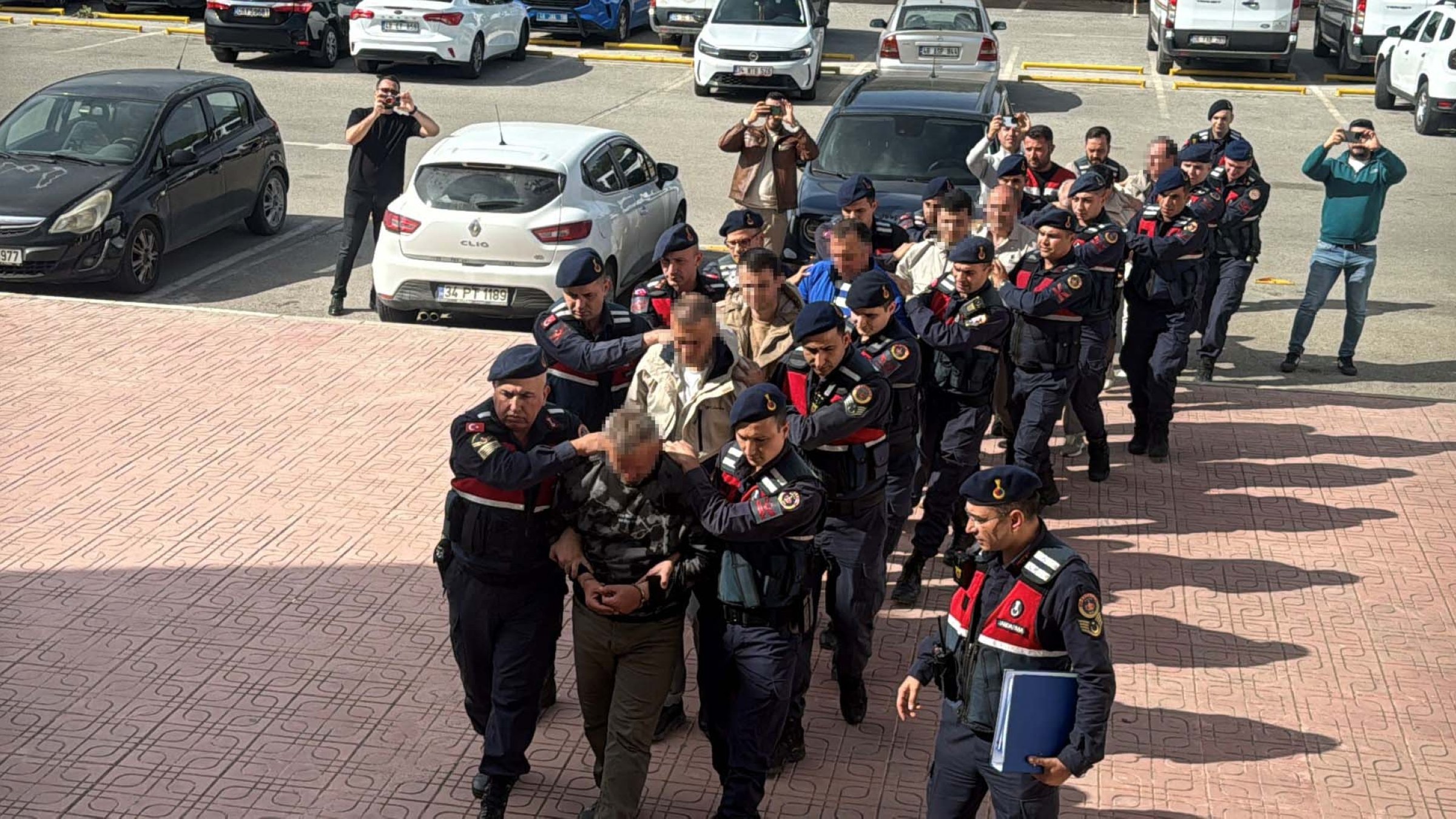 Security officers escort FETÖ suspects captured while trying to flee to Greece, Muğla, southwestern Türkiye, Nov. 1, 2025. (DHA Photo)