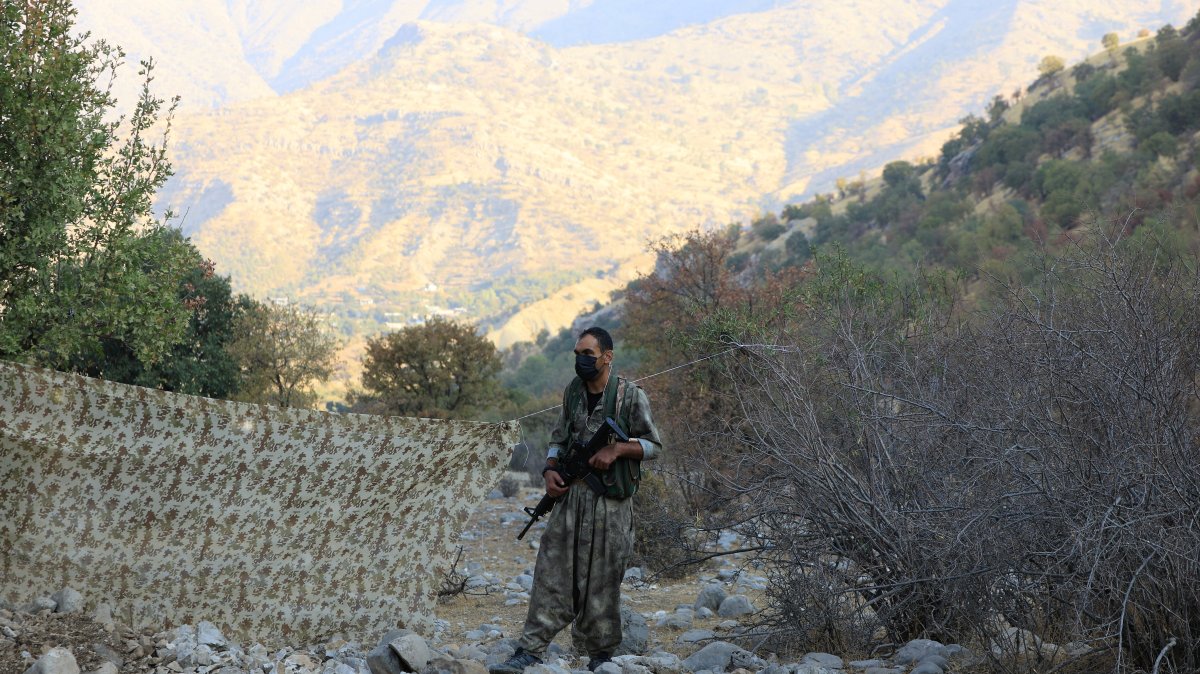 A PKK member is seen at an event by the terrorist group to announce withdrawal from Türkiye, in the Qandil mountains, Iraq, Oct. 26, 2025. (Reuters Photo)