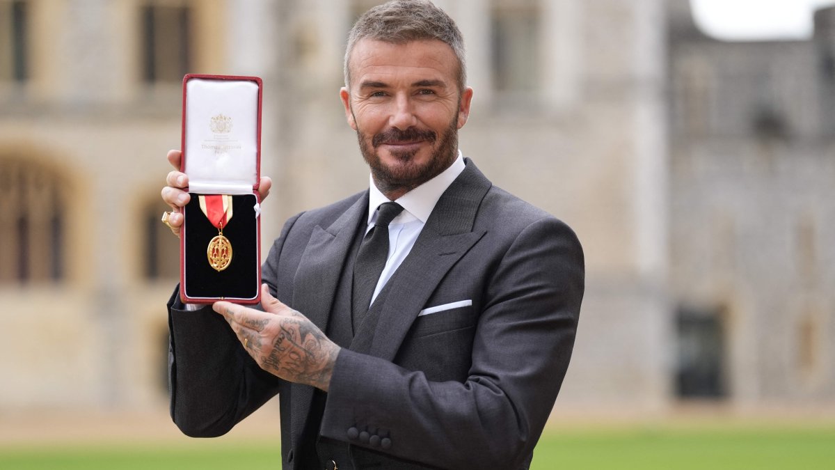 Former England footballer David Beckham poses with his medal after being appointed as a Knight Bachelor (Knighthood) for services to sport and charity at an investiture ceremony at Windsor Castle, London, U.K., Nov. 4, 2025. (AFP Photo)