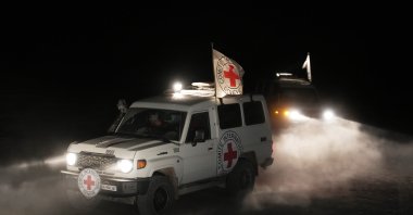 Red Cross vehicles carrying the bodies of three people believed to be deceased hostages handed over by Hamas make their way toward the border crossing with Israel, to be transferred to Israeli authorities, Deir al-Balah, Gaza Strip, Palestine, Nov. 2, 2025. (AP Photo)
