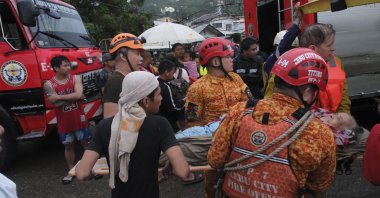 Emergency responders help a person affected by flooding caused by typhoon Kalmaegi, Cebu City, Philippines, Nov. 4, 2025. (EPA Photo)