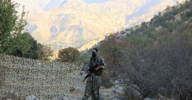 A PKK member is seen at an event by the terrorist group to announce withdrawal from Türkiye, in the Qandil mountains, Iraq, Oct. 26, 2025. (Reuters Photo)