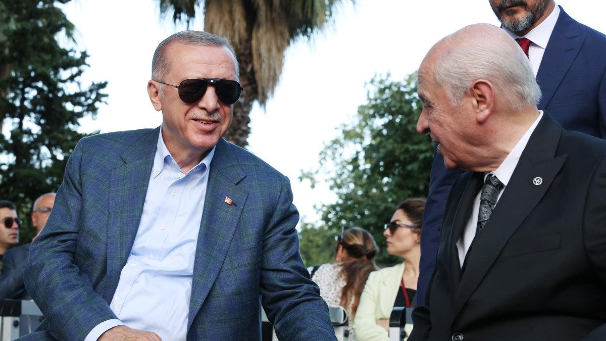 President Recep Tayyip Erdoğan and MHP leader Devlet Bahçeli chat during an event, Istanbul, Türkiye, July 15, 2022. (AA Photo)