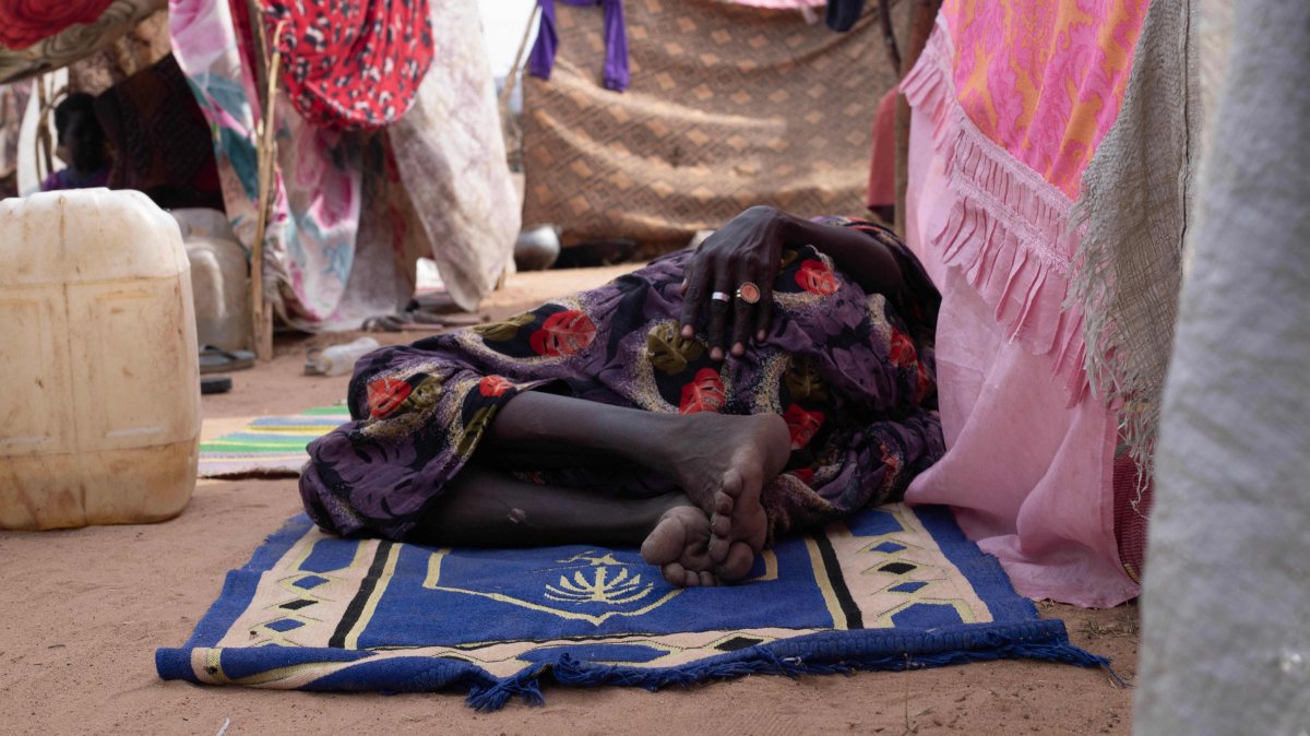 A displaced Sudanese who fled el-Fasher after the city fell to the Rapid Support Forces (RSF), rest on a mat in the camp of Um Yanqur, located on the southwestern edge of Tawila, Sudan, Nov. 3, 2025. (AFP Photo)