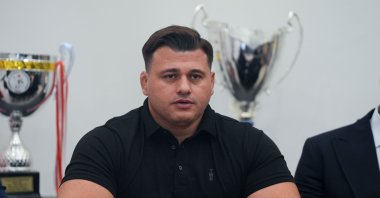 Turkish wrestler Rıza Kayaalp speaks during a press conference announcing that the Court of Arbitration for Sport (CAS) overturned his four-year suspension at the Taha Akgül Sports Complex, Ankara, Türkiye, Nov. 4, 2025. (AA Photo)