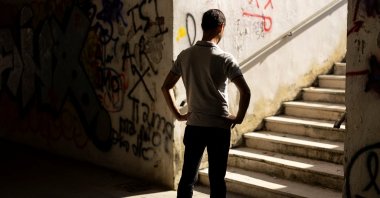 Giovanni, a former gambling addict, waits to be interviewed by Reuters in Pisa, Italy, Oct. 15, 2025. REUTERS/Remo Casilli. He requested that his name be changed and his face concealed to protect his privacy.