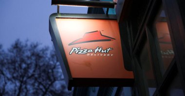 A view of a Pizza Hut sign, in London, U.K., Dec. 30, 2024. (Reuters Photo)