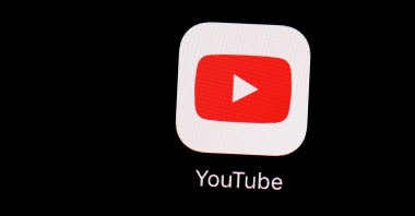 The YouTube app logo is seen on an iPad screen, March 20, 2018. (AP Photo)