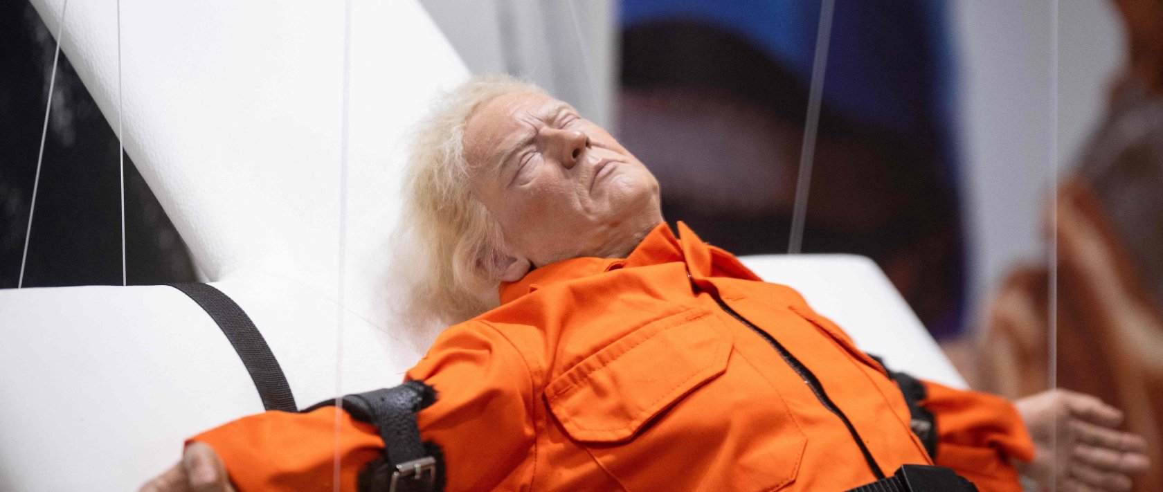 This photograph shows the art piece by British artist Mason Storm called &quot;Saint or Sinner,&quot; depicting U.S. President Donald Trump dressed in an orange prison jumpsuit on a cross, displayed at an exhibition space, Basel, Switzerland, Nov. 3, 2025. (AFP Photo)