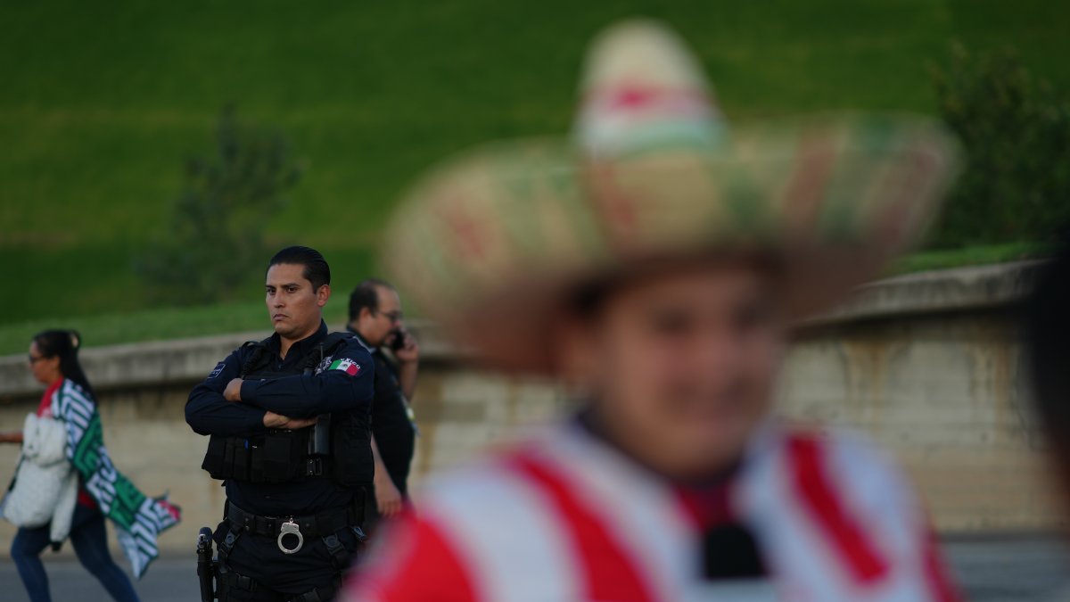 A police officer stands guard outside Akron Stadium prior to a friendly match between Mexico and Ecuador, Guadalajara, Mexico, Oct. 14, 2025. (AP Photo)
