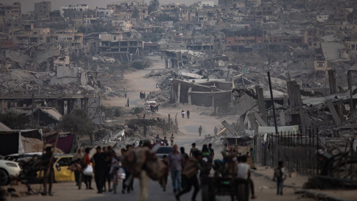 Displaced Palestinians sit next to their destroyed homes in Khan Younis camp in the southern Gaza Strip, Palestine, Nov. 5, 2025. (EPA Photo)
