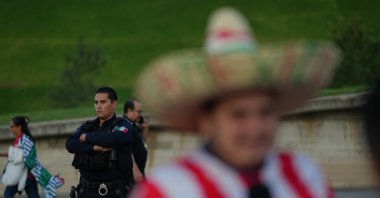 A police officer stands guard outside Akron Stadium prior to a friendly match between Mexico and Ecuador, Guadalajara, Mexico, Oct. 14, 2025. (AP Photo)