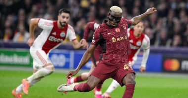 Galatasaray&#039;s Victor Osimhen (R) shoots from the penalty spot and scores his team&#039;s third goal during the UEFA Champions League, league phase day 4, football match against Ajax at the Johan Cruijff ArenA, Amsterdam, Netherlands, Nov. 5, 2025. (AFP Photo)