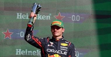 Red Bull&#039;s Max Verstappen celebrates with a trophy on the podium after finishing in third place in the Mexico City Grand Prix at the Autodromo Hermanos Rodriguez, Mexico City, Mexico, Oct. 26, 2025. (Reuters Photo)