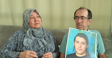Zuhal Dölek (L) and Hasan Dölek, parents of Furkan Dölek, wait for news of their son in Kozan, Adana, Türkiye, Sept. 2, 2025. (AA Photo)