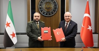 Defense Minister Yaşar Güler (R) and his Syrian counterpart Murhaf Abu Qasra pose after signing a military cooperation agreement at the Defense Ministry, Ankara, Türkiye, Aug.13, 2025 (IHA Photo)
