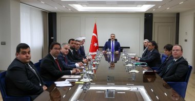 Foreign Minister Hakan Fidan is seen with members of the Western Thrace Turkish community at the ministry in Ankara, Türkiye, Nov.6, 2025 (AA Photo)