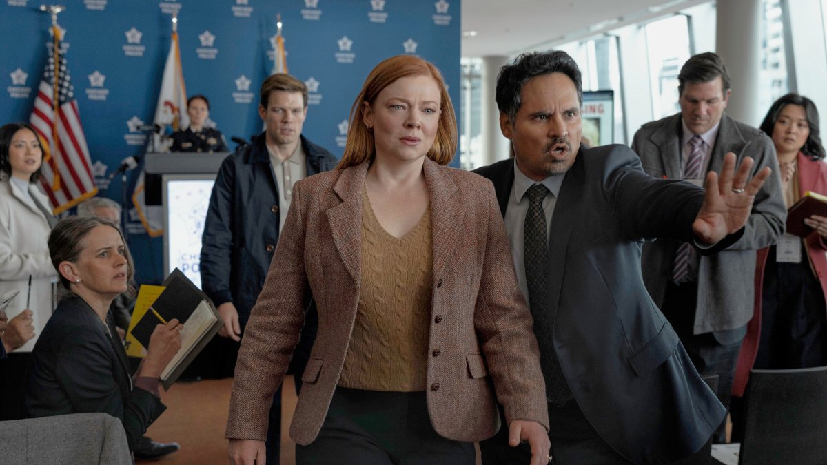 This image released by Peacock shows Sarah Snook (C) and Michael Peña (R) in a scene from "All Her Fault." (AP Photo)