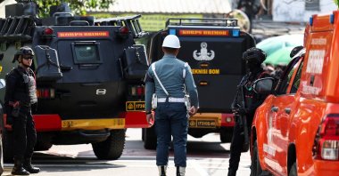 Armed police personnel and military personnel guard near an area after an explosion occurred at a school complex, Jakarta, Indonesia, Nov. 7, 2025. (Reuters Photo)