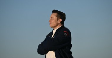Elon Musk steps off Air Force One upon arrival at Morristown Municipal Airport in Morristown, New Jersey, U.S., March 22, 2025. (AFP Photo)