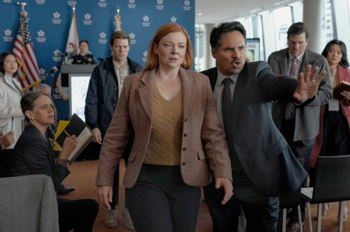 This image released by Peacock shows Sarah Snook (C) and Michael Peña (R) in a scene from &quot;All Her Fault.&quot; (AP Photo)