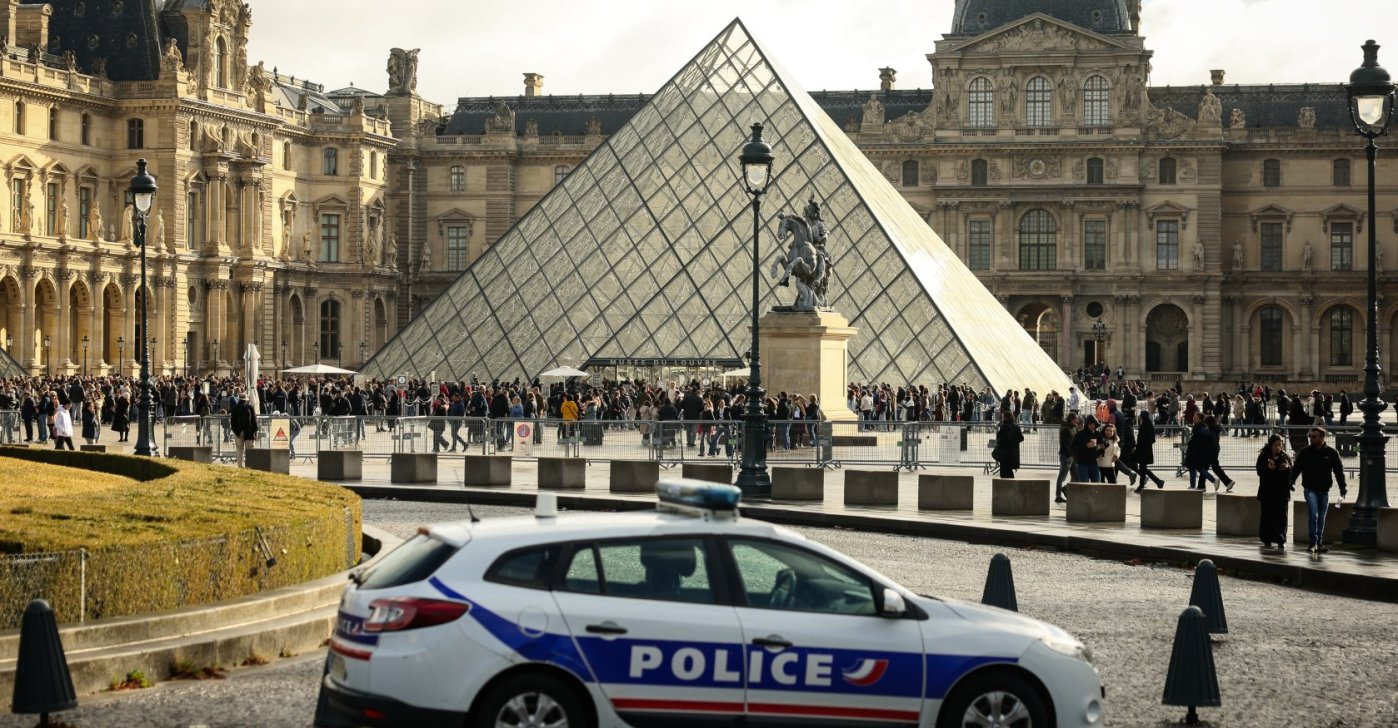A police car parks in the courtyard of the Louvre museum, one week after the robbery, Paris, France, Oct. 26, 2025. (AP Photo)