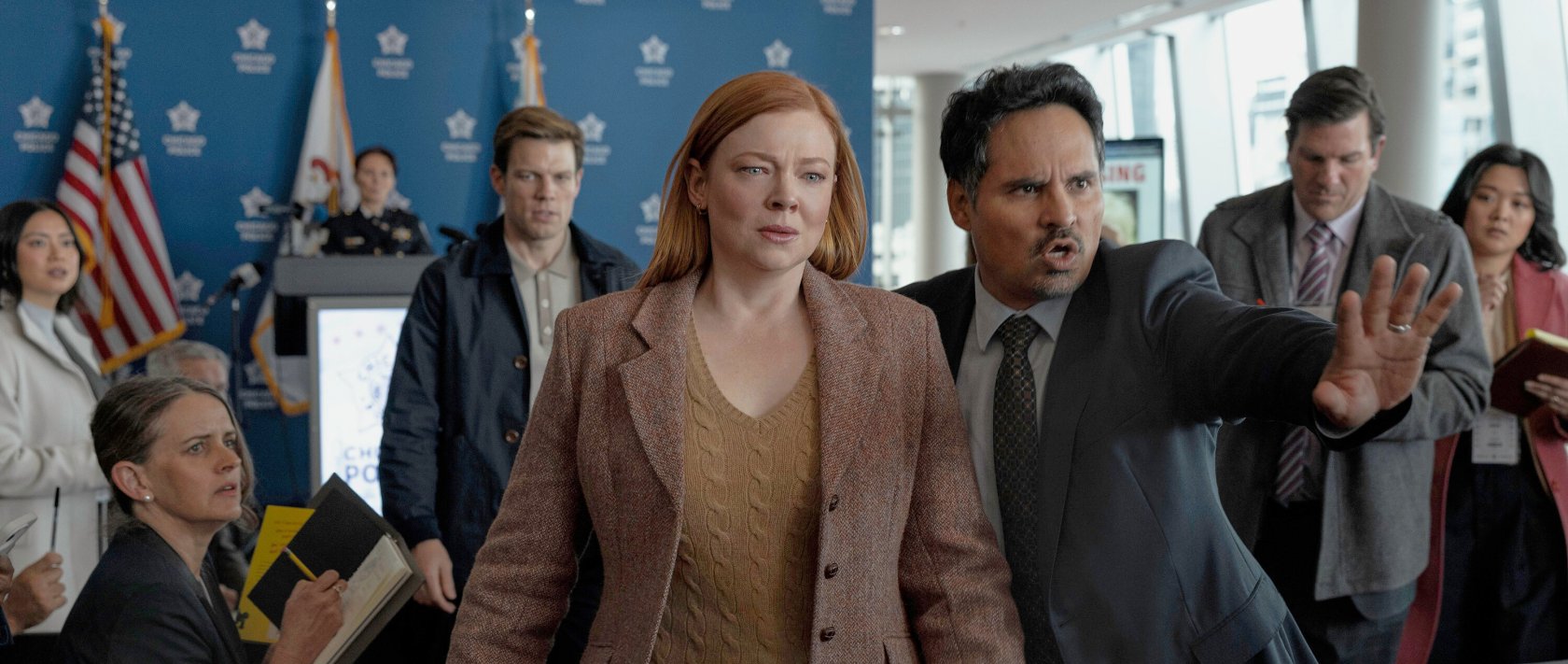 This image released by Peacock shows Sarah Snook (C) and Michael Peña (R) in a scene from &quot;All Her Fault.&quot; (AP Photo)