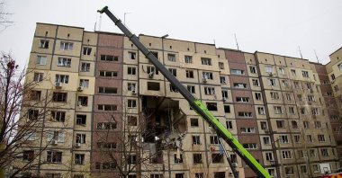 Ukrainian rescuers work at the site of a heavily damaged residential building following a Russian air attack in Dnipro, Ukraine, Nov. 8, 2025 (AFP Photo) 