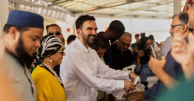 New York City mayor-elect Zohran Mamdani hands out food at a mosque, San Juan, Puerto Rico, U.S., Nov. 7, 2025. (AP Photo)