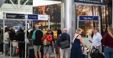 Travelers wait in line at a security checkpoint at George Bush Intercontinental Airport in Houston, Texas, U.S., Nov. 7, 2025. (AFP Photo)