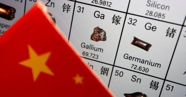 The flag of China is placed next to the elements of gallium and germanium on a periodic table, in this illustration picture taken on July 6, 2023. (Reuters Photo)