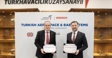 Turkish Aerospace Industries (TAI) and BAE Systems officials pose during the signing of a memorandum on cooperation in this photo released on Nov. 6, 2025. (TAI via AA Photo)