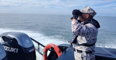A staff member of the Malaysian Maritime Enforcement Agency searches for victims of a boat from Myanmar that sank near the Malaysia-Thailand border, Langkawi, Malaysia, Nov. 9, 2025. (Reuters Photo)