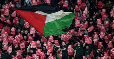 Celtic fans wave a Palestinian flag in the stands during a Champions League match, Glasgow, Ireland, Feb. 12, 2025. (Getty Images)