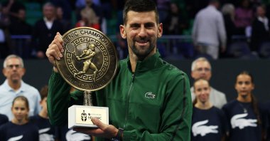 Novak Djokovic celebrates with the trophy after winning the Hellenic Championship final against Italy&#039;s Lorenzo Musetti, Athens, Greece, Nov. 8, 2025. (Reuters Photo)