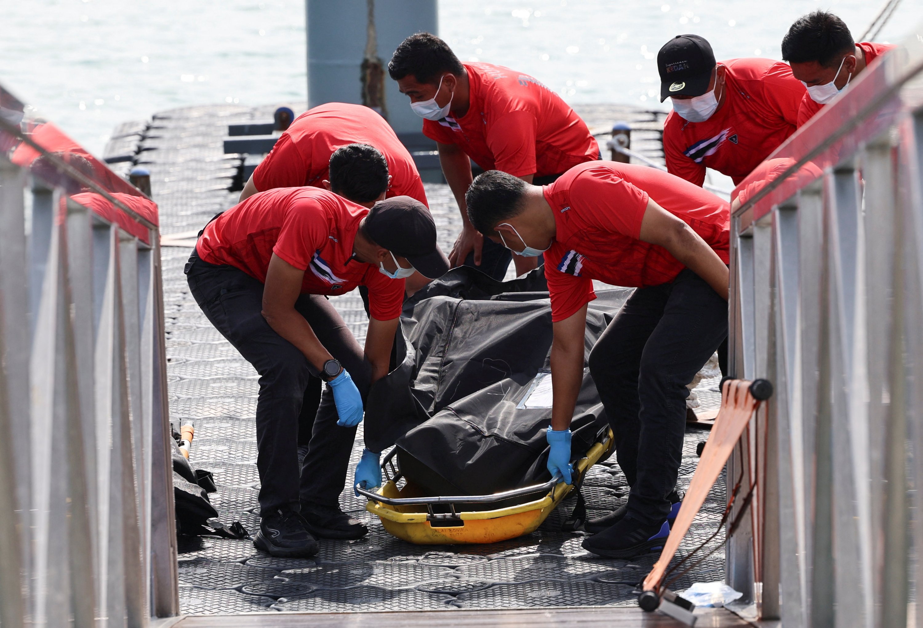 Malaysia widens search for missing Rohingya boats after 11 die