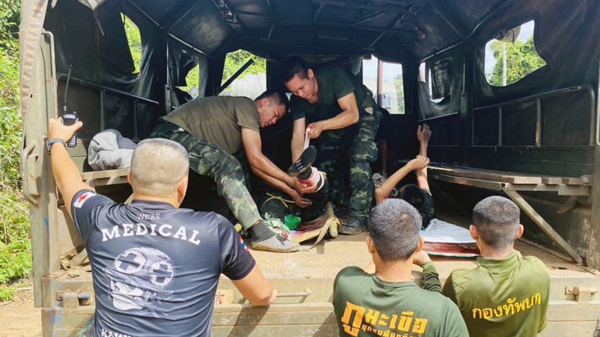 Two injured Thai soldiers receive first aid after a landmine explosion during a patrol at the Thai-Cambodian border, in Si Sa Ket province, Thailand, Nov. 10, 2025. (EPA Photo)