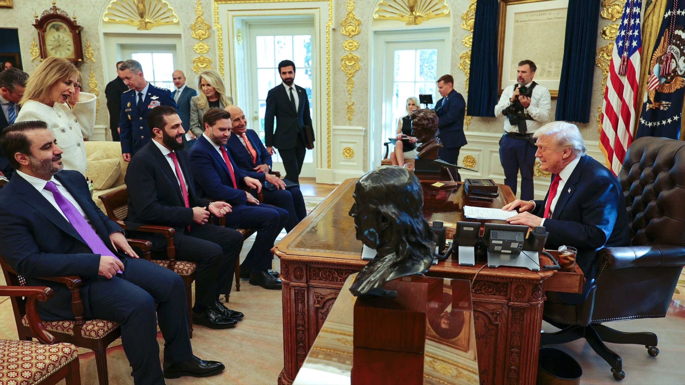 U.S. President Donald Trump meeting with Syria's President Ahmed al-Sharaa (2nd L), seated alongside Syrian Foreign Minister Asaad al-Shaibani at the White House, Washington, D.C., U.S., Nov. 10, 2025. (SANA Handout via AFP Photo)
