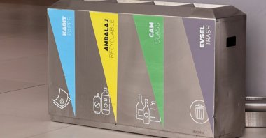 Metallic recycling bins displaying four separate compartments for different types of waste, Istanbul, Türkiye, June 5, 2025. (Shutterstock Photo)