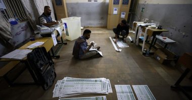 Electoral employees count ballots at a polling station after a special voting day for Iraqi security forces, taking place two days before polls open to the public in the parliamentary elections, Baghdad, Iraq, Nov. 9, 2025. (AFP Photo)