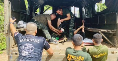 Two injured Thai soldiers receive first aid after a landmine explosion during a patrol at the Thai-Cambodian border, in Si Sa Ket province, Thailand, Nov. 10, 2025. (EPA Photo)