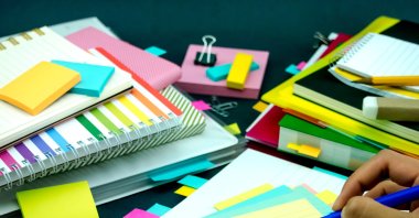 A student learns Turkish vocabulary and writes the meaning of the words. (Shutterstock Photo)