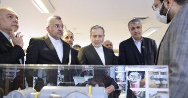 In this photo, released on Monday, Nov. 10, 2025 by the Atomic Energy Organization of Iran, Foreign Minister Abbas Araghchi (C) listens to explanations as he visits an exhibition of the country&#039;s nuclear achievements during his tour to the Atomic Energy Organization, while he is accompanied by the head of the Atomic Energy Organization of Iran, Mohammad Eslami (2nd R), Tehran, Iran. (AP Photo)