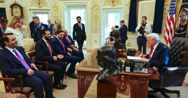 U.S. President Donald Trump meeting with Syria&#039;s President Ahmed al-Sharaa (2nd L), seated alongside Syrian Foreign Minister Asaad al-Shaibani at the White House, Washington, D.C., U.S., Nov. 10, 2025. (SANA Handout via AFP Photo)