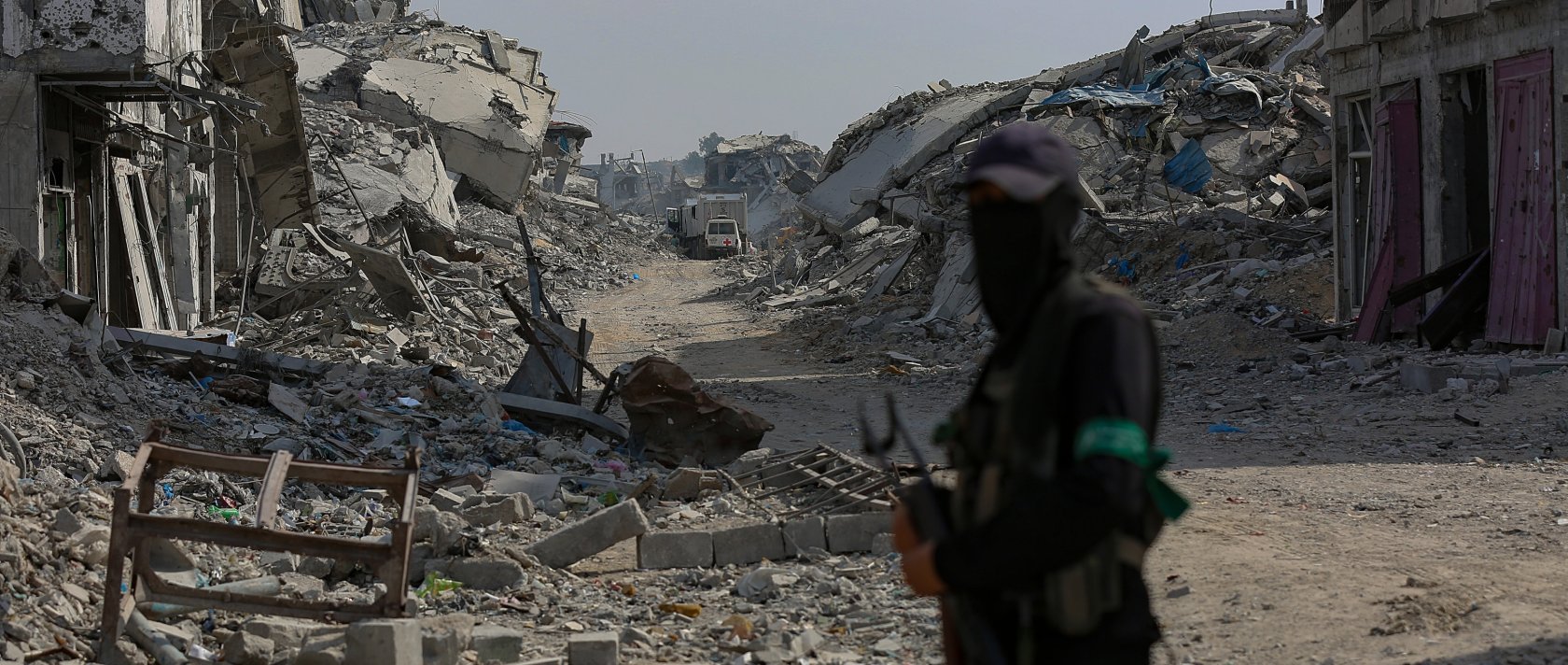 Fighters of the Al-Qassam Brigades, the military wing of the Hamas movement, stand guard as they search for the bodies of Israeli hostages alongside Red Cross workers in the east of the Gaza Strip, Nov. 2, 2025. (EPA Photo)