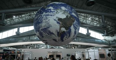 A huge globe representing the earth hangs inside a ward at the COP30 U.N. Climate Change Conference premises, Belem, Brazil, Nov. 10, 2025. (AFP Photo)